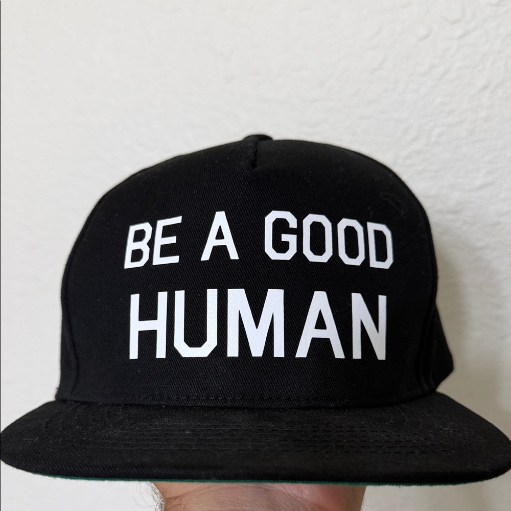 Black flat billed snap back hat